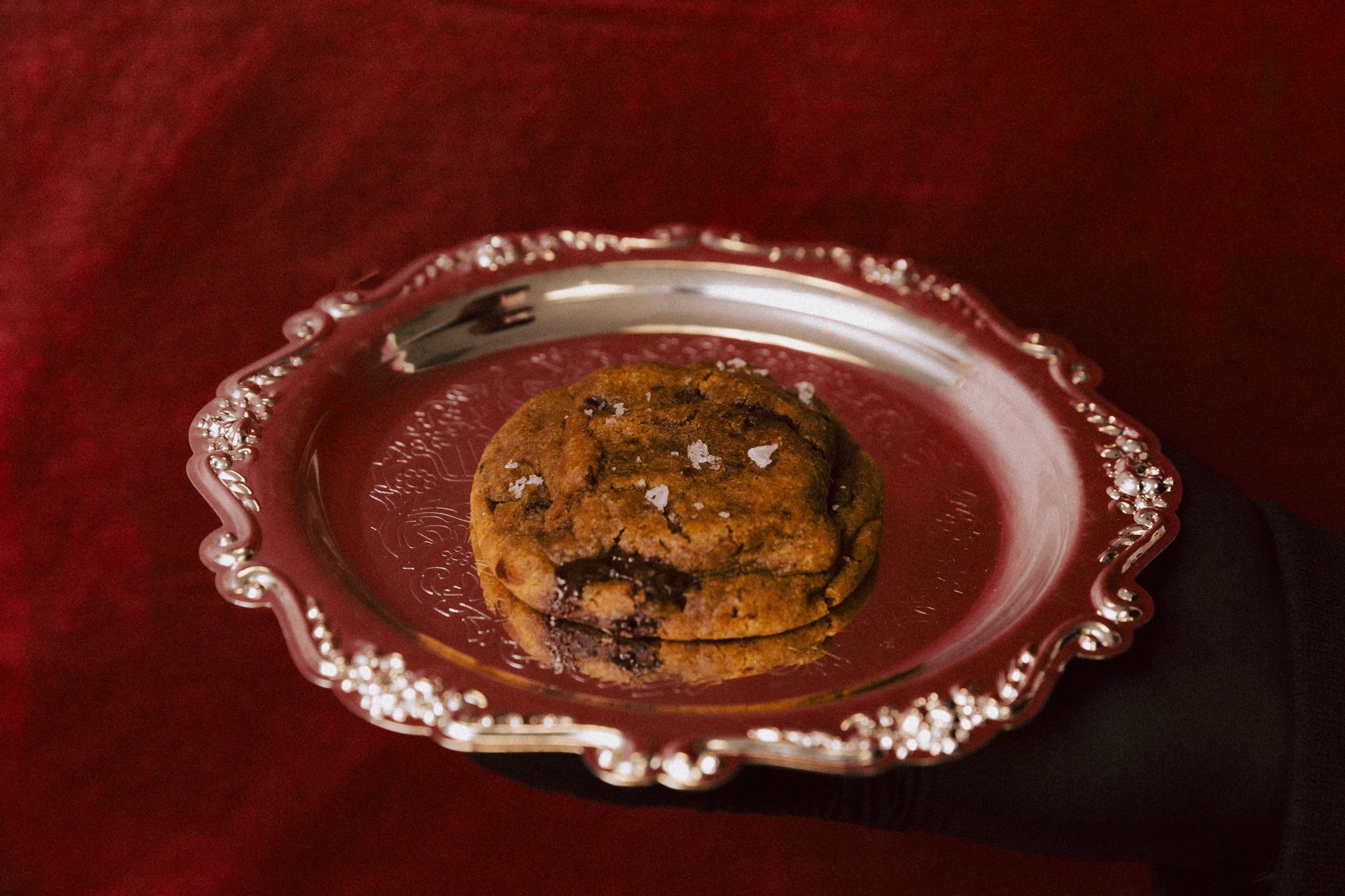A Ring & Robe cookie presented on an engraved silver tray